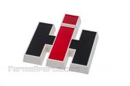 PLASTIC IH EMBLEM (FOR FRONT OR FOR CAB) - WHITE PLASTIC W/PAINTED RED 'I' AND BLACK 'H'. 2 MOUNTING HOLES ON BACKSIDE. 4 TALL & 3-5/8 WIDE - International Farmall: FRONT EMBLEM: 544, 656, 664, 706, CAB EMBLEM: 4100, 4156, 4166, 4186, 4366, 4386 - 2751848R1
